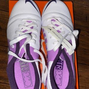 White and purple soccer cleats